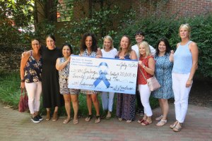 Blue Ribbon Run Members Pose with Large Check for $20,000.